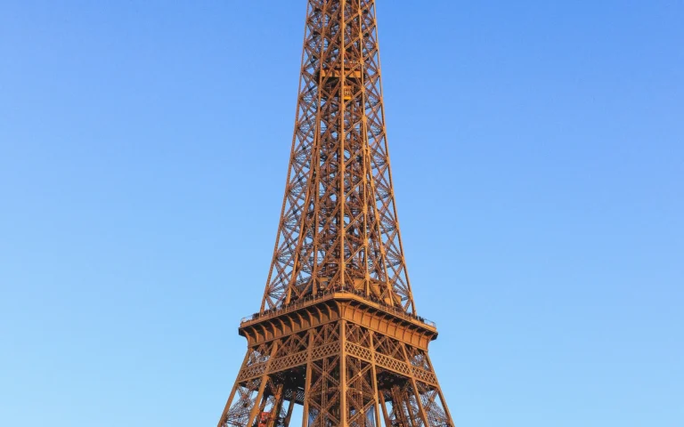 Eiffel Tower in Paris under a blue sky